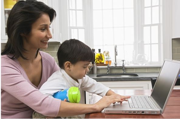 mother and child using computer