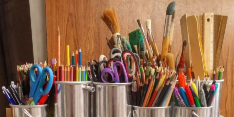 Metal containers of art supplies