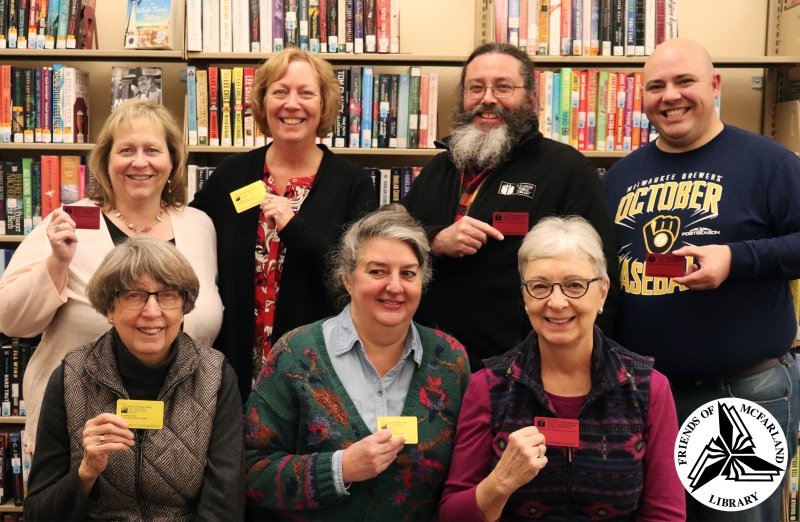 Friends of the McFarland Library members displaying their library cards