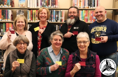 Friends of the McFarland Library members displaying their library cards